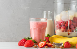 an assortment of fruit and smoothie ingredients