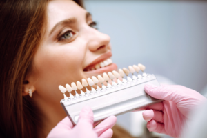 a patient speaking with their dentist about veneers